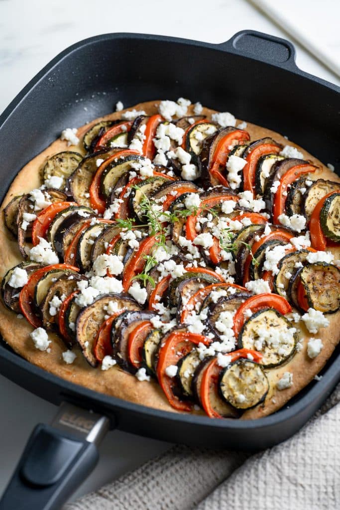 Zoom on a zucchini, eggplant and tomato tarte with feta cheese