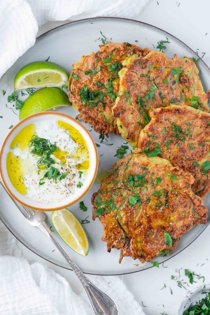 zoom on a plate of zucchini Pancakes with Yogurt dip
