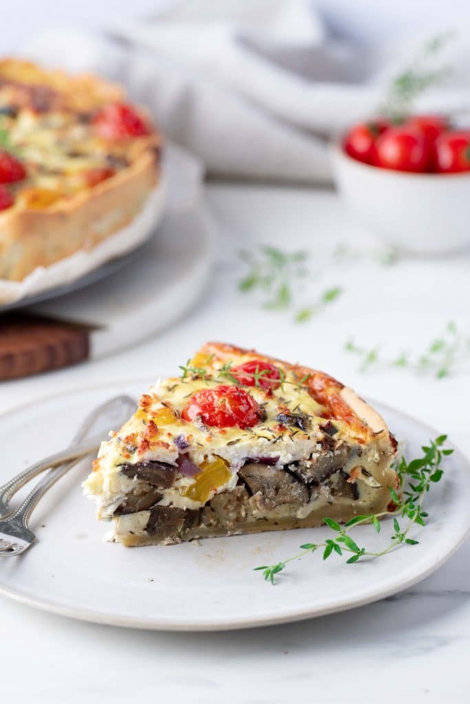 Zoom in on a slice of vegetable and feta quiche