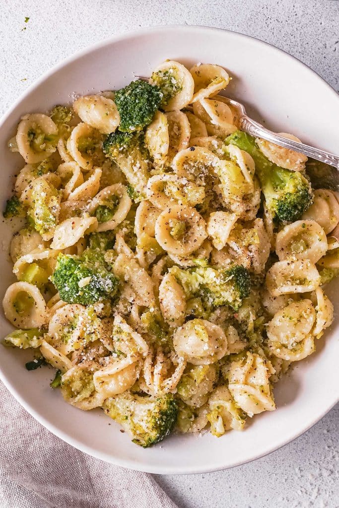 Zoom on a plate of orecchiette pasta with broccoli