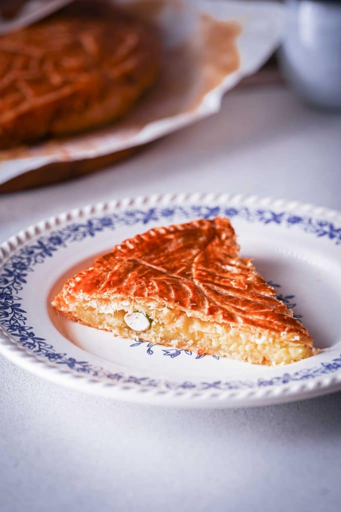 Zoom on a piece of Galette des Rois with the fève in it