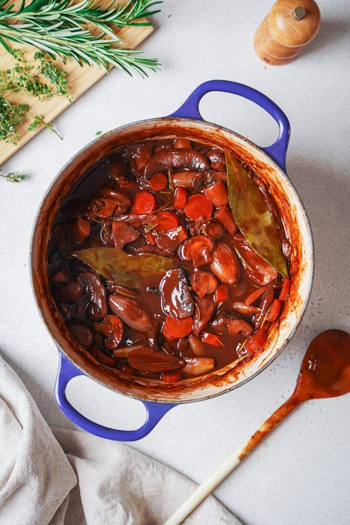Zoom on a dutch oven with mushroom bourguignon 