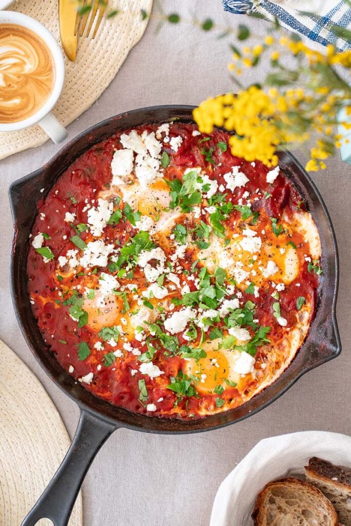 Top view of a shakshuka with Tomato and Feta (without peppers) on a breakfast table