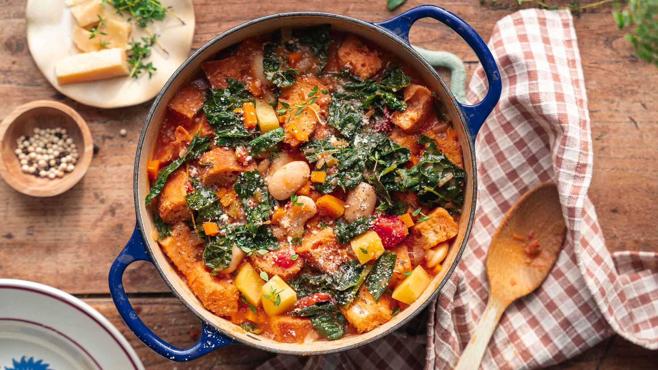 Ribollita, the Tuscan bread and bean soup, in a blue Dutch oven